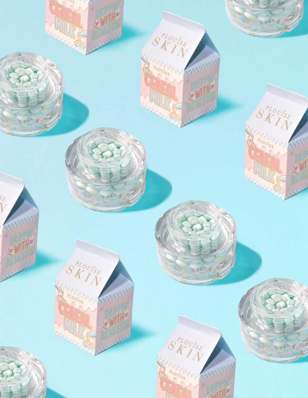 Clear containers of P.Louise Dose of Dreams Vitamin C Capsule Cream with blue capsule within them surrounded by milk cartons