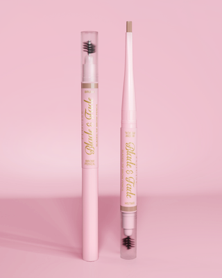 An image of two P.Louise Blade & Fade Eyebrow Pencils With Brush, one with the lid on and the other with the lid off showing the blade against a pink background