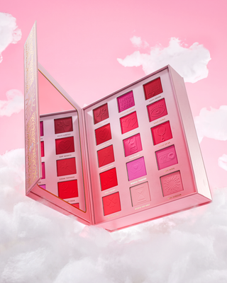 Manifest Blushed Ever After blush palette with pink and red shades on a pink and white cloud background