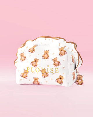 A P.Louise large teddy bear print skincare and makeup bag with a frill design against a pink background