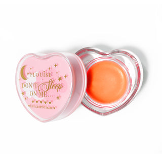 Pink heart-shaped lip sleeping mask with the lid off on a white background