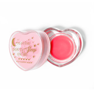 Pink heart-shaped lip sleeping mask with the lid off on a white background