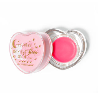 Pink heart-shaped lip sleeping mask with the lid off on a white background