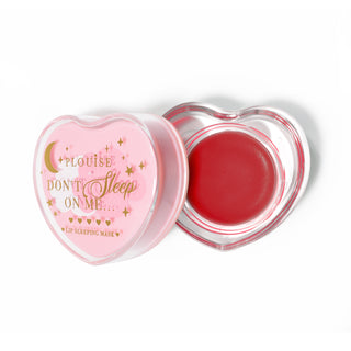 Pink heart-shaped lip sleeping mask with the lid off on a white background