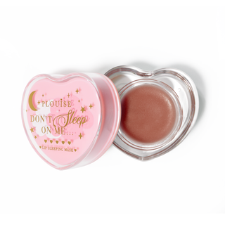 Pink heart-shaped lip sleeping mask with the lid off on a white background